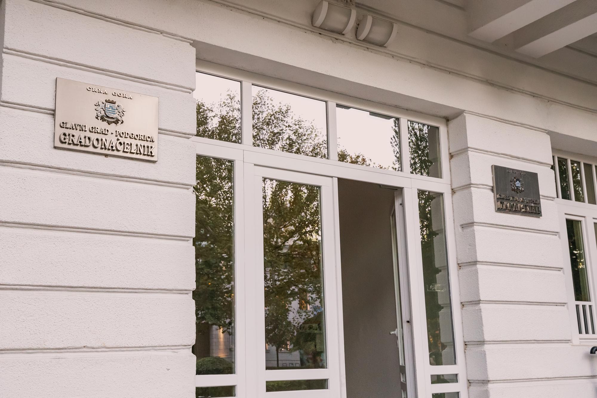 Workshop exterior with a small sign and window